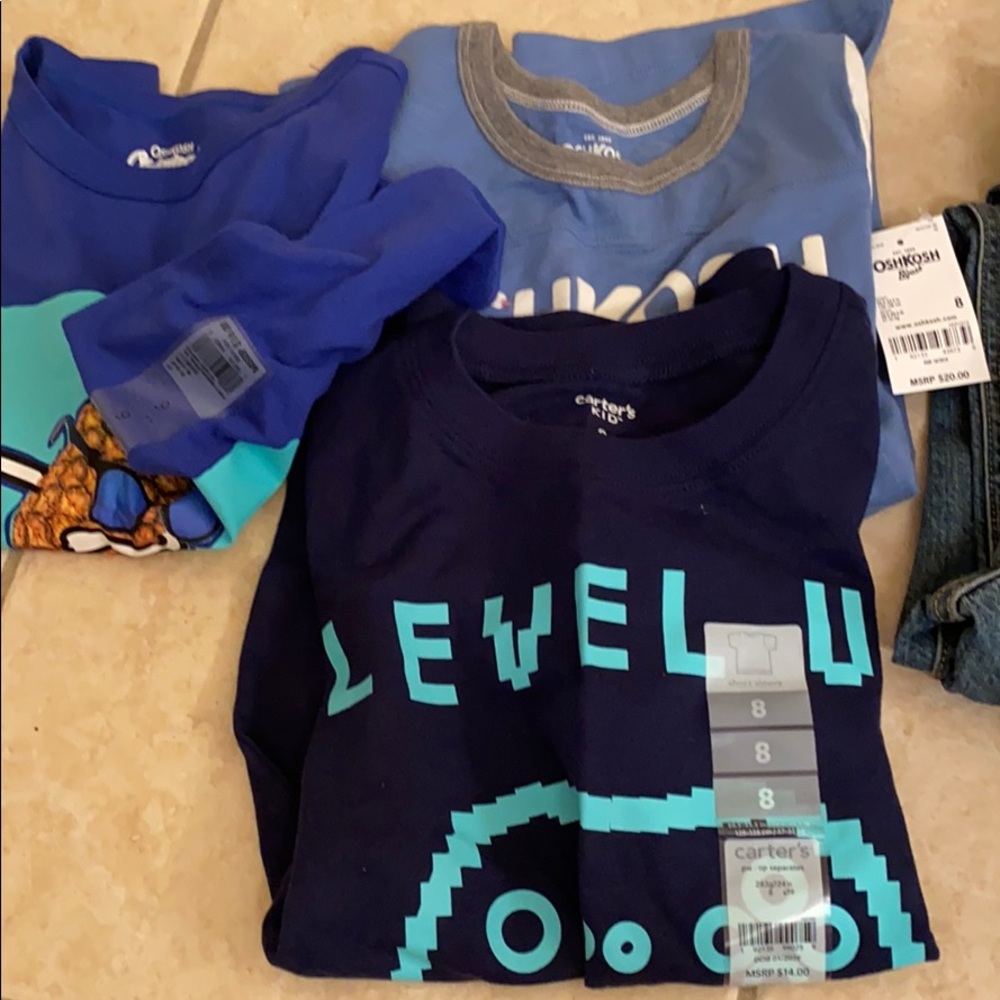Never worn kid clothes 11 shirts and 3 pants